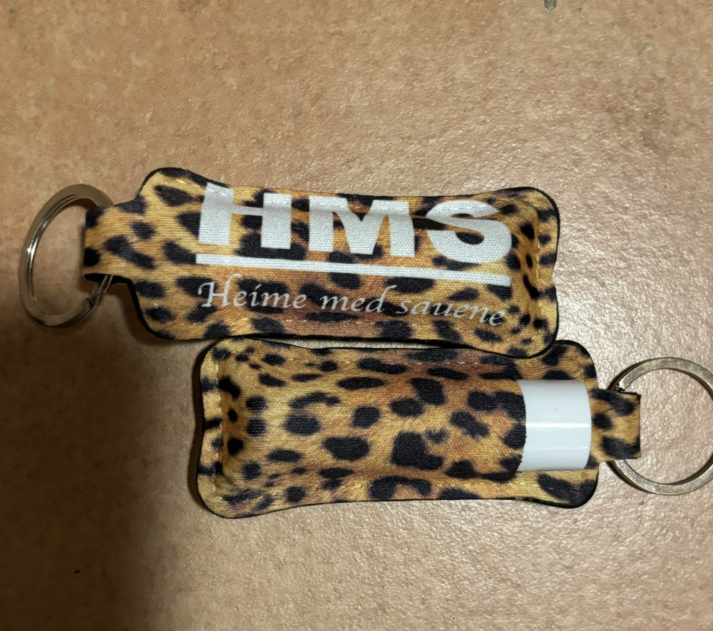Hovedbilde HEIME MED SAUENE NØKKELRING MED LIPBALM